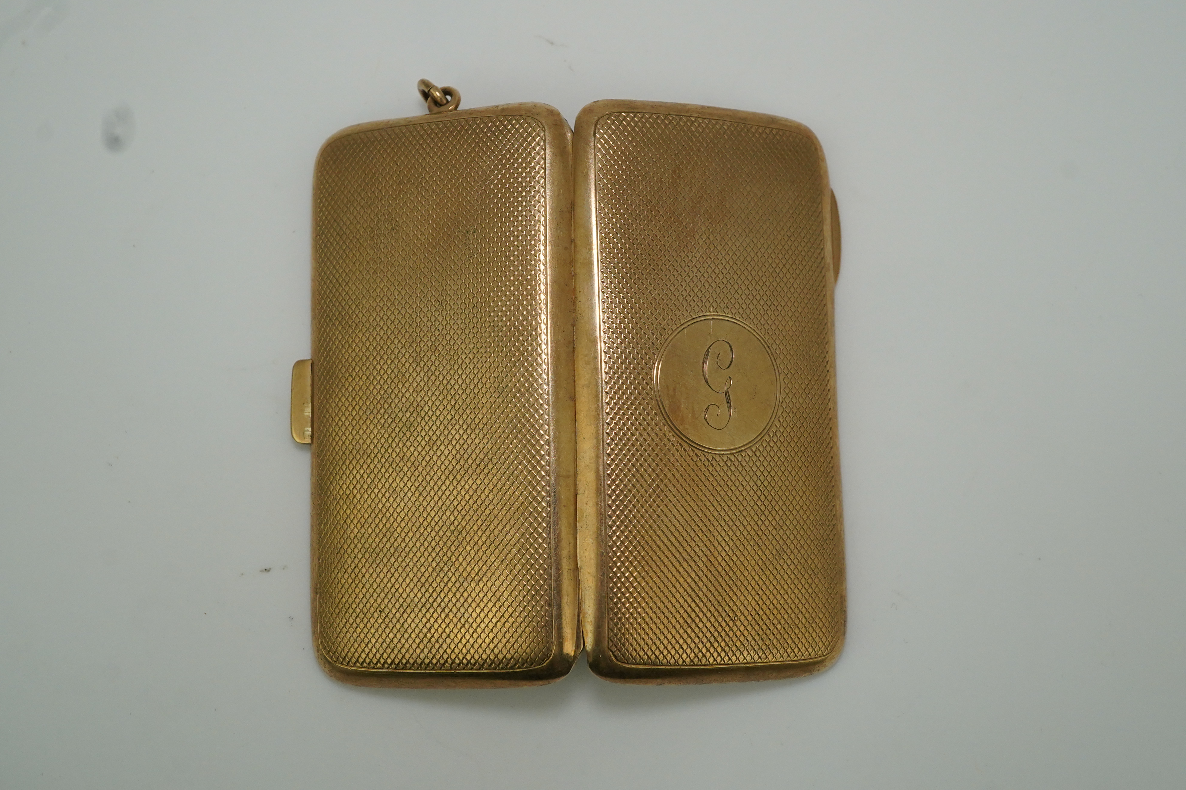 A George V 9ct gold cigarette case, circa 1919